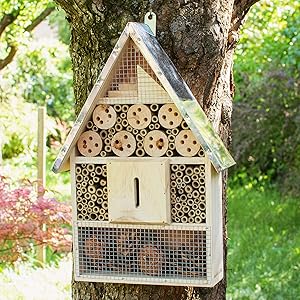 insect hotel mounted on tree
