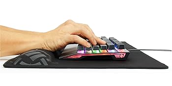 hands typing on keyboard while using built in wrist rest