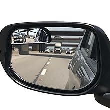 blind spot mirror showing truck that you can not see in the car mirror.