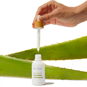 Hand holding Nourishing Youth Serum Dropper