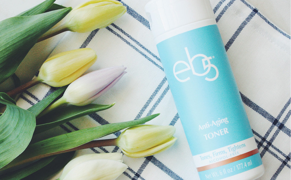 eb5 toner laying on blanket with tulips