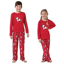 Boy and girl wearing matching Snoopy Christmas PJs
