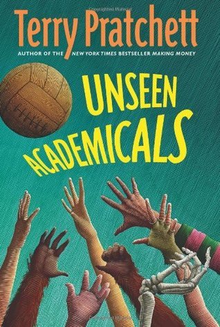 Book cover of Unseen Academicals by Terry Pratchett. The title is in large yellow and green letters, with a brown football above it. Multiple outstretched hands in varied skin tones and clothing styles reach toward the ball, suggesting a chaotic scramble.