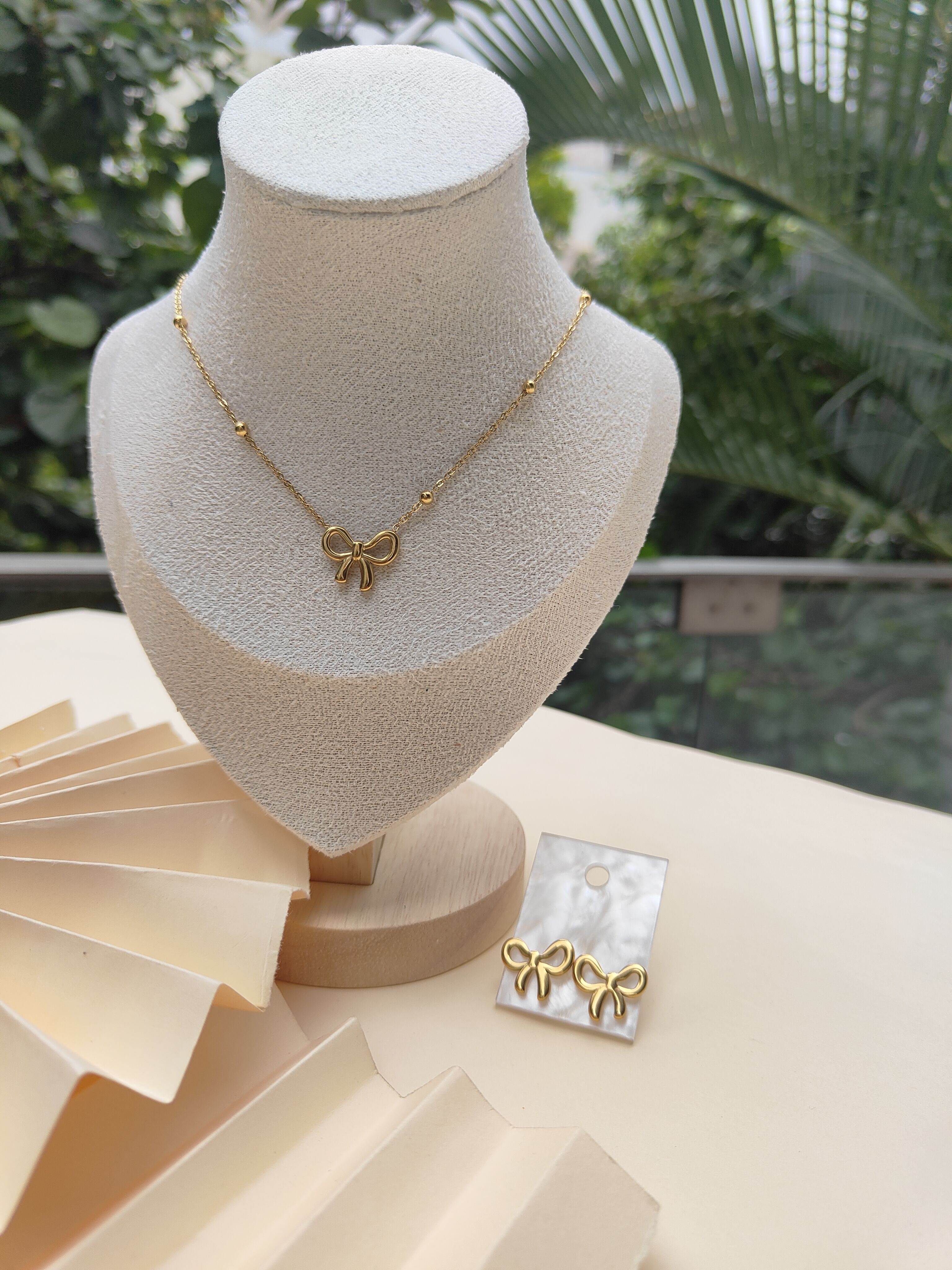 Photo inspiration: Buy Liora Bowset 18K Gold Plated Bow Necklace Earrings Photo Inspiration